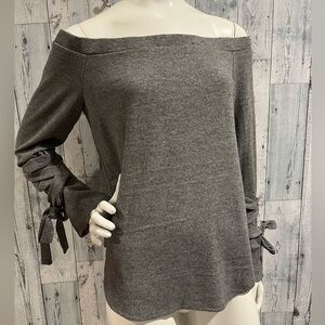 Grey off shoulder sweater with lace up sleeves